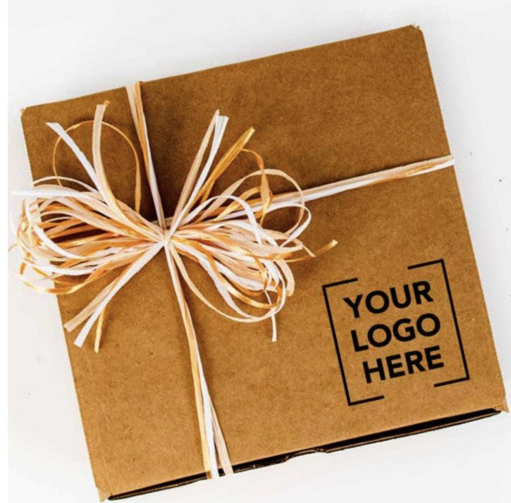 Kraft corporate gift box tied with raffia ribbon and stamped with a custom company logo, from Connect Gifting